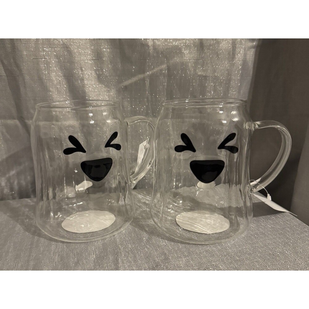 A Pair of Glass Ghost Mugs Cute Squinting Laughing Face 18.5oz Clear Lightweight